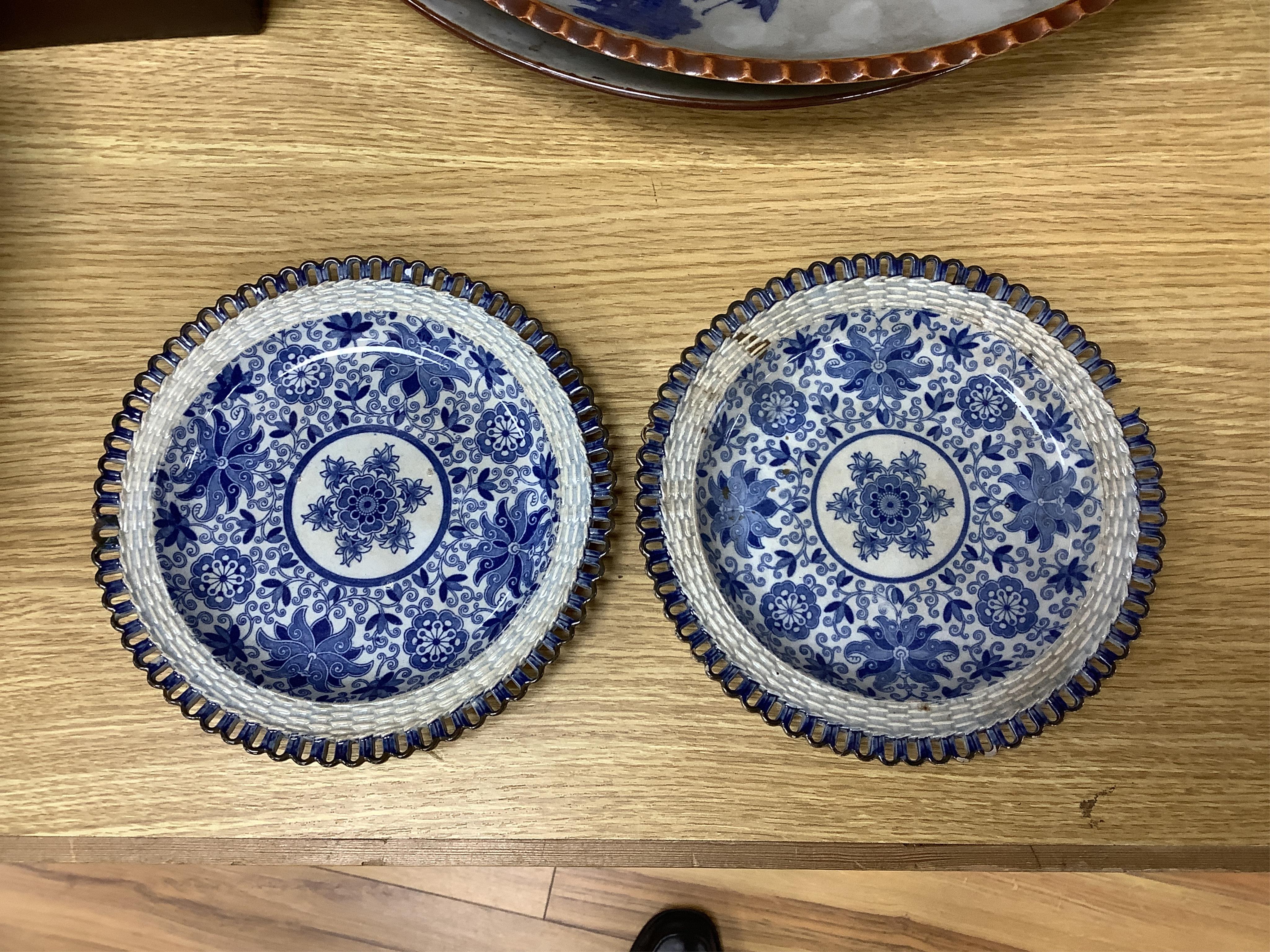 A group of 19th century pearlware set of tea bowls and saucers and to similar basket with border plates